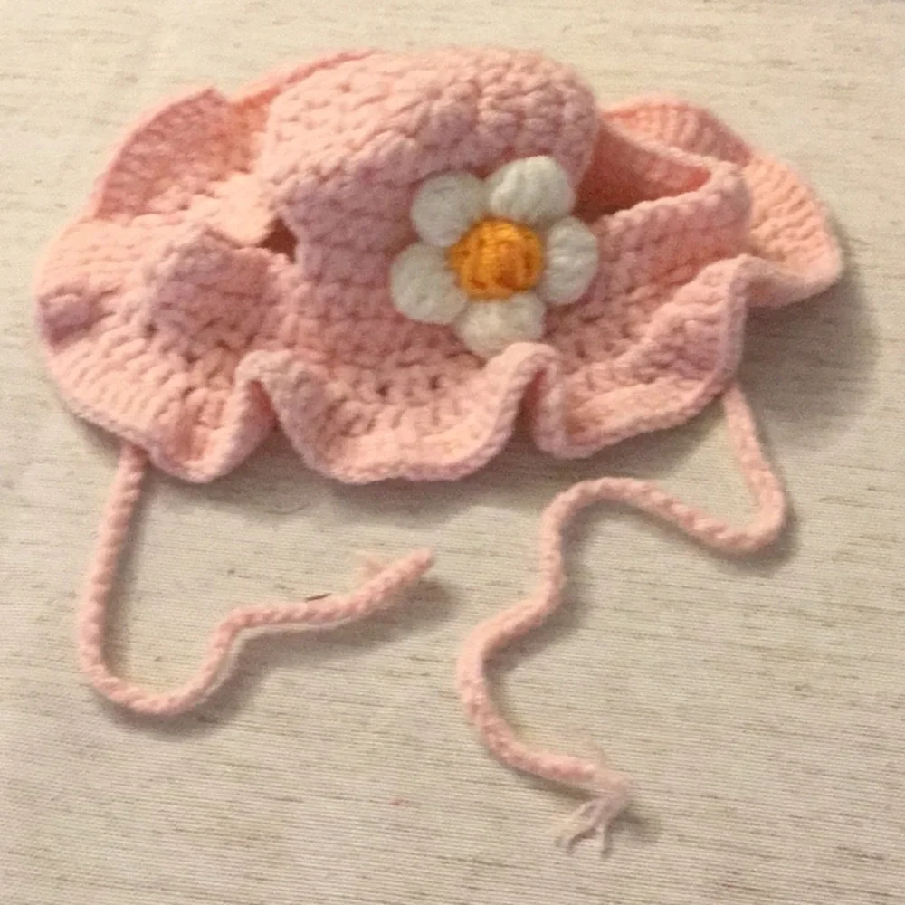 Pink Crochet bonnet with beautiful white flower.
